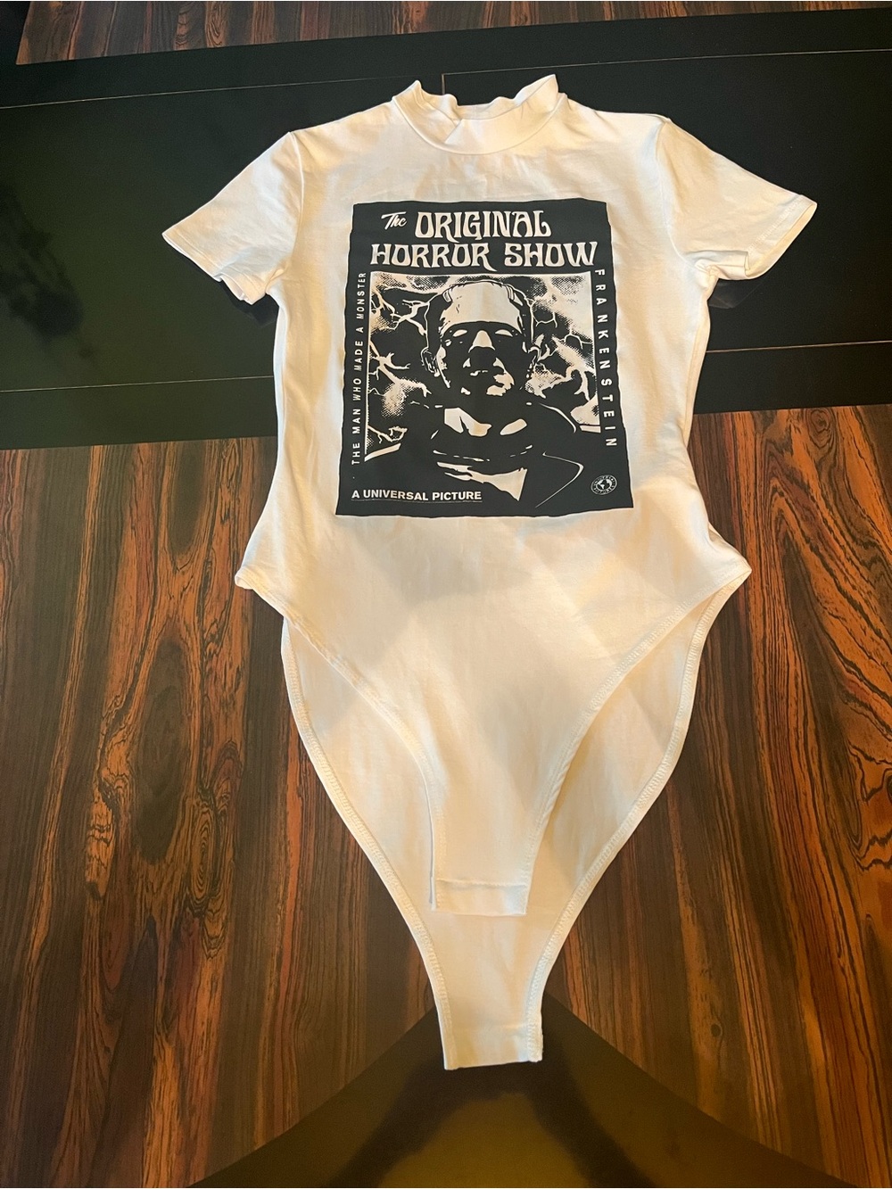 White Graphic Short-Sleeve Bodysuit with 'The Original Horror Show' Print binteg